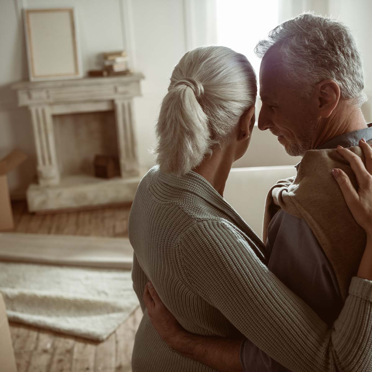 image of older couple packing to move out